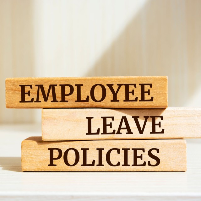 three rectangular blocks stacked each with a word spelled out Employee Leave and Policies